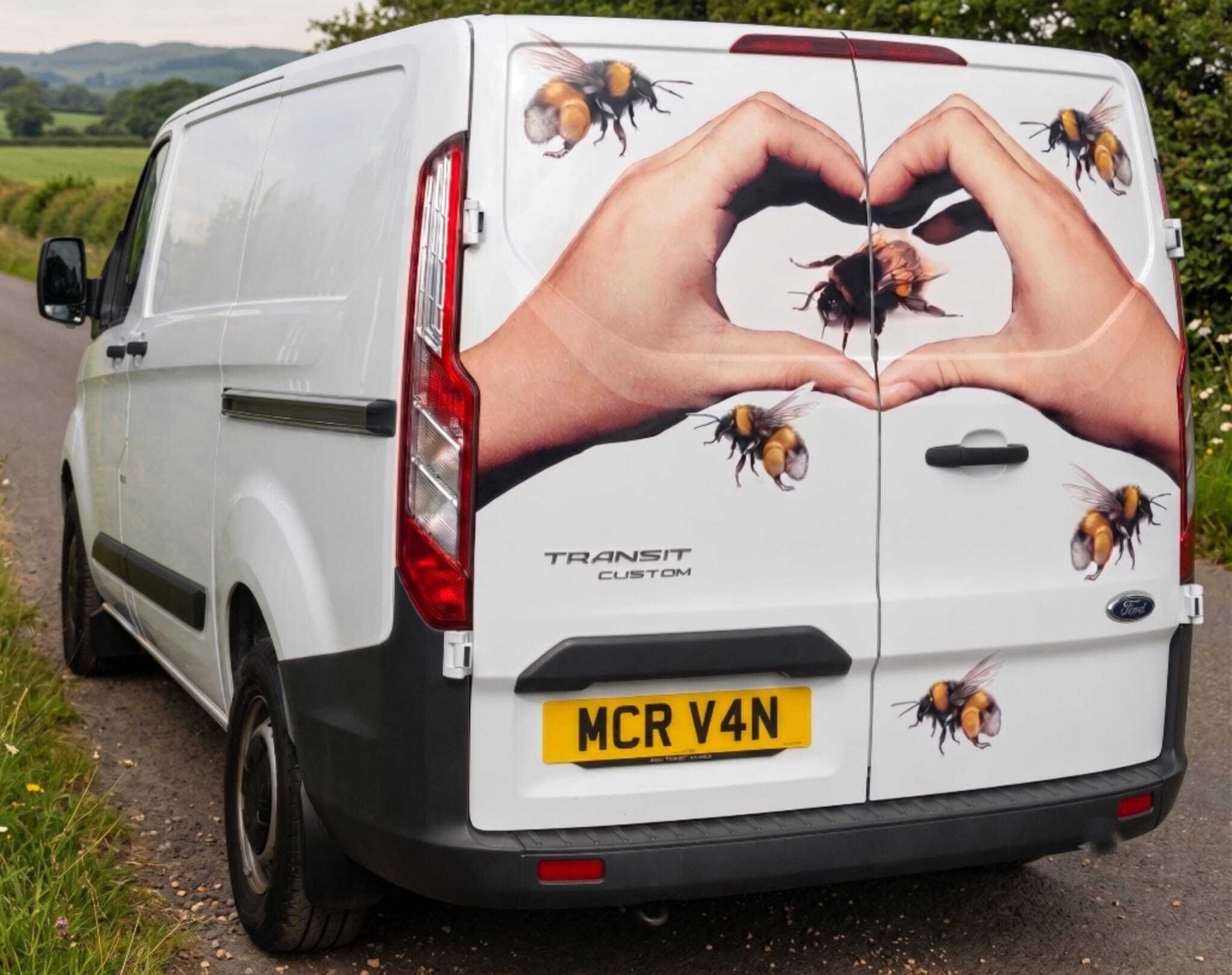 A Manchester Van Hire van finished with custom livery and signage